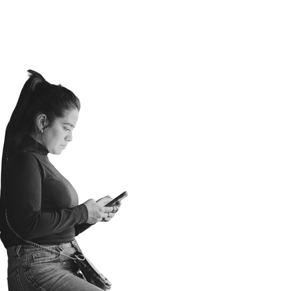 Woman seated in profile, looking at her phone