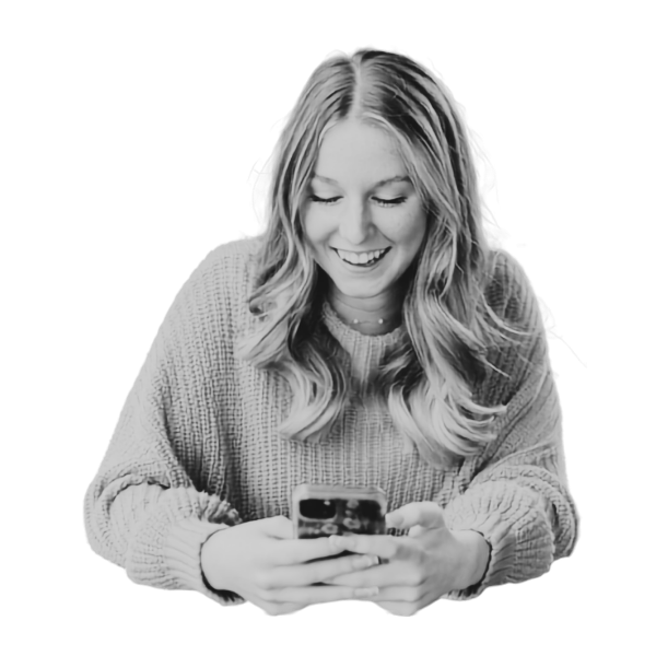 Woman smiling at her phone
