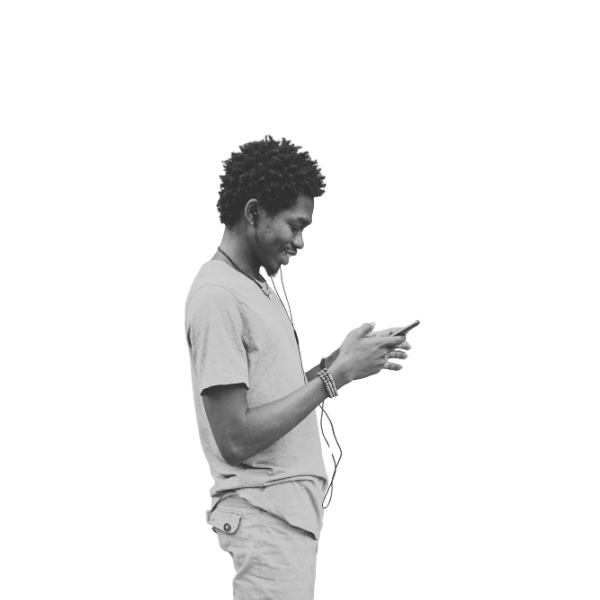 Man walking with earbuds, looking at his phone