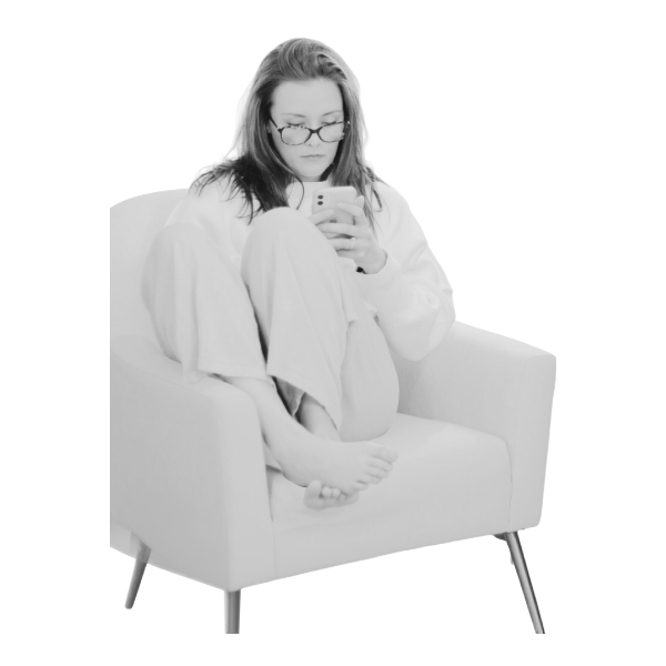 Woman relaxed in an armchair holding a mug